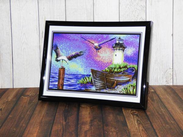 Kleines dekoratives Wandbild mit Pixel Art im schwarzen Rahmen