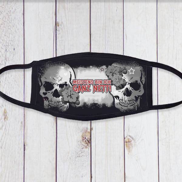 Schwarze Gesichtsmaske im Totenkopf Design mit Spruch „Meistens bin ich ganz nett“
